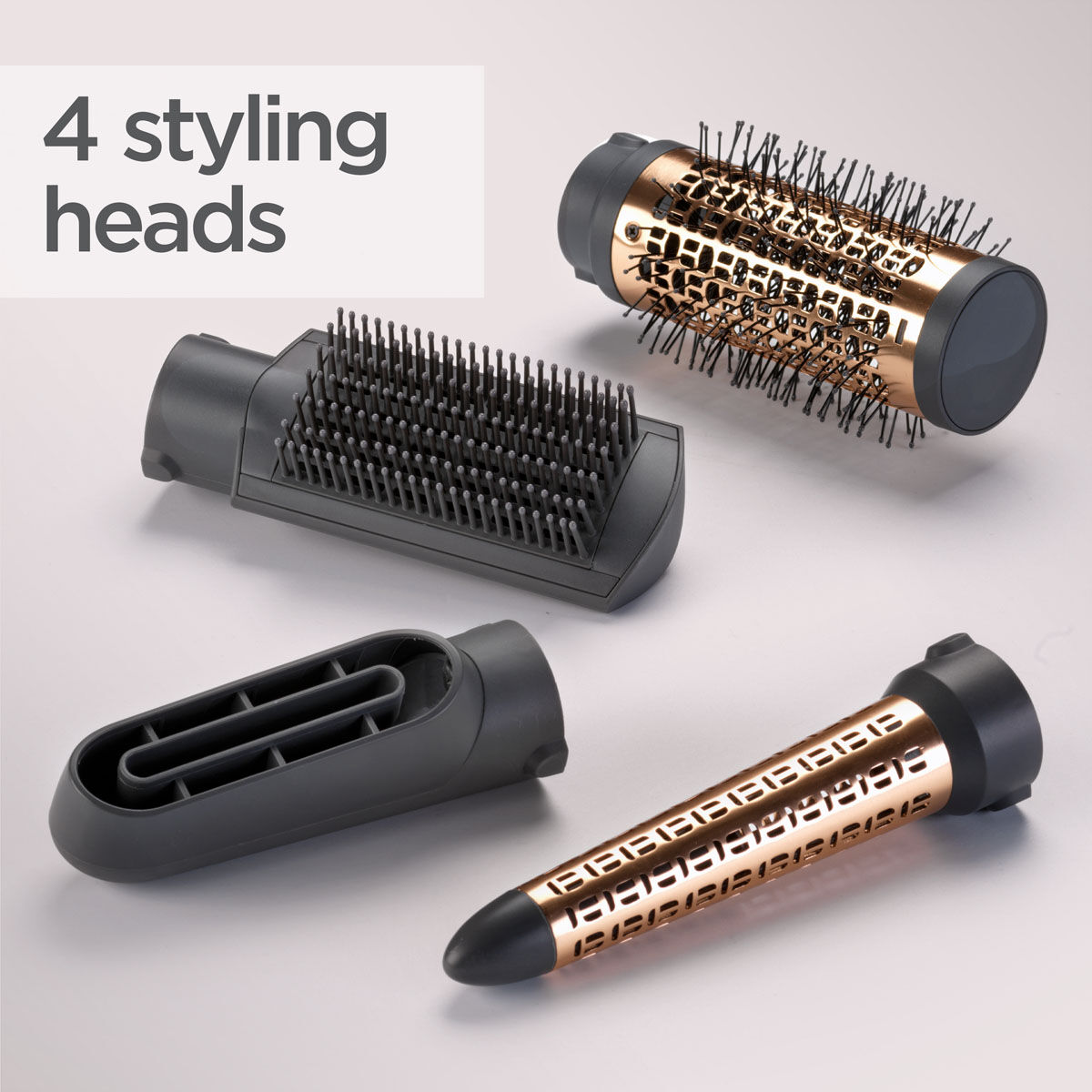4 styling heads (50mm thermal brush, paddle brush, drying nozzle, curling attachment)